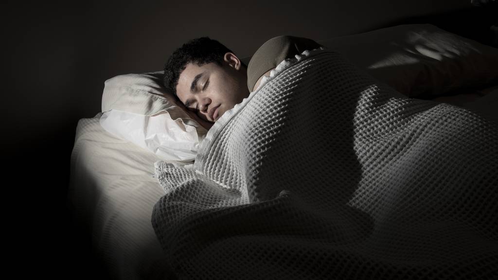 A service member sleeps after his duty day at Joint Base San Antonio – Lackland, Texas, March 24, 2023.